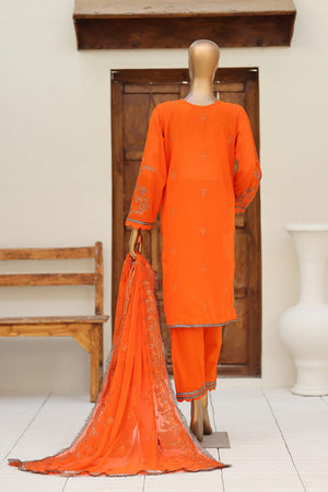 Orange traditional outfit with dupatta on a mannequin against a wooden door background