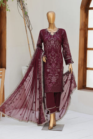 Maroon embroidered outfit with a sheer dupatta on a mannequin against a white wall.