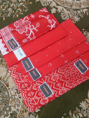 Red bandana patterned products with labels on a patterned surface